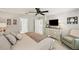 Bright bedroom with a ceiling fan, a spacious dresser, and an ensuite bathroom at 8297 Artisan Way, Seminole, FL 33777