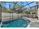 Enjoy the privacy in this screened-in pool area with a comfortable lounge area at 8297 Artisan Way, Seminole, FL 33777