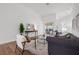 Living room with wood floors, recessed lights, slider doors to pool, and tasteful decor at 8914 Westbay Blvd, Tampa, FL 33615