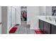 Bathroom featuring a large walk in shower, double vanity, and walk in closet at 8949 Southern Charm Cir, Brooksville, FL 34613
