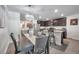 Dining area with a view of the kitchen, complete with stainless steel appliances at 8949 Southern Charm Cir, Brooksville, FL 34613