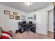Home office with a grey futon and multiple wall decorations at 8949 Southern Charm Cir, Brooksville, FL 34613
