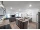 Open concept kitchen and dining room with a view of the living room with barstool seating available at 8949 Southern Charm Cir, Brooksville, FL 34613