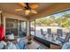 Enjoy outdoor dining in this screened-in patio with views of the yard at 8949 Southern Charm Cir, Brooksville, FL 34613