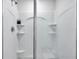 All white stand up shower with shampoo nook at 8949 Southern Charm Cir, Brooksville, FL 34613