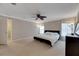Spacious bedroom with neutral walls, carpet flooring, and large windows for plenty of natural light at 9010 Grand Bayou Ct, Tampa, FL 33635