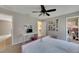 Bedroom features twin beds, ensuite bath, desk and closet at 9010 Grand Bayou Ct, Tampa, FL 33635