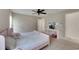 Shared bedroom with fan, desk, ensuite bath, and closet at 9010 Grand Bayou Ct, Tampa, FL 33635