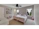 Charming bedroom featuring two twin beds, sheer curtains, and a ceiling fan at 9010 Grand Bayou Ct, Tampa, FL 33635