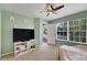 Bedroom with a ceiling fan and natural light at 9010 Grand Bayou Ct, Tampa, FL 33635