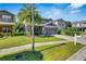 Charming two-story home with a well-maintained lawn and a view of the neighborhood at 9010 Grand Bayou Ct, Tampa, FL 33635