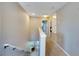 Upstairs hallway featuring carpet, and access to multiple rooms at 9010 Grand Bayou Ct, Tampa, FL 33635