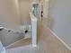 Second floor hallway with stair access, and neutral walls at 9010 Grand Bayou Ct, Tampa, FL 33635
