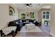 Inviting living room with backyard views, ceiling fan, and comfortable seating at 9010 Grand Bayou Ct, Tampa, FL 33635