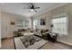 Inviting living room featuring hardwood floors, a neutral color palette, and comfortable seating at 9010 Grand Bayou Ct, Tampa, FL 33635