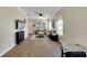 Inviting living room with hardwood floors, ample seating, and lots of natural light at 9010 Grand Bayou Ct, Tampa, FL 33635