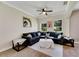 Relaxing living room with backyard views, ceiling fan, and contemporary decor at 9010 Grand Bayou Ct, Tampa, FL 33635