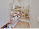 Well-stocked walk-in pantry with wire shelving, providing ample storage for kitchen essentials and supplies at 9010 Grand Bayou Ct, Tampa, FL 33635