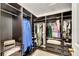 Spacious walk-in closet with custom shelving and ample storage space at 9010 Grand Bayou Ct, Tampa, FL 33635