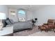 Bedroom featuring a large window, desk area, and comfortable armchair for a relaxing retreat at 9376 French Quarters Cir, Weeki Wachee, FL 34613