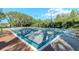Outdoor bocce ball courts with manicured hedges and green spaces for recreation at 9376 French Quarters Cir, Weeki Wachee, FL 34613