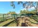 Community dog park with fenced enclosure, seating, and space for pets to play at 9376 French Quarters Cir, Weeki Wachee, FL 34613