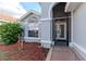 Well-maintained single-story home displaying an arched front entryway at 9376 French Quarters Cir, Weeki Wachee, FL 34613