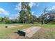Outdoor horseshoe pits surrounded by green grass and tall trees, perfect for community fun at 9376 French Quarters Cir, Weeki Wachee, FL 34613