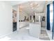 Bright open concept kitchen with marble floors, granite countertops and modern appliances at 9376 French Quarters Cir, Weeki Wachee, FL 34613