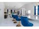 Bright kitchen with granite countertops, stainless steel appliances, and stylish blue bar stools at 9376 French Quarters Cir, Weeki Wachee, FL 34613