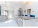 Bright kitchen with marble floors, granite countertops, gray cabinets and modern lighting at 9376 French Quarters Cir, Weeki Wachee, FL 34613