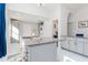 Bright kitchen with marble floors, granite countertops, laundry hook-up and stainless faucet at 9376 French Quarters Cir, Weeki Wachee, FL 34613