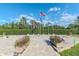 Veterans memorial with American flags, a walkway, and manicured landscaping at 9376 French Quarters Cir, Weeki Wachee, FL 34613