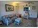 Cozy living room showing open breakfast bar to the kitchen and neutral carpeting at 9815 47Th N Ave # 303, St Petersburg, FL 33708