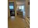 Open living room with sliding doors to the lanai and entryway to the bedroom at 9815 47Th N Ave # 303, St Petersburg, FL 33708