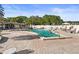 Community pool with ample seating and a shaded lounge area, perfect for relaxing poolside at 9815 47Th N Ave # 303, St Petersburg, FL 33708