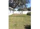 Fenced backyard with grassy lawn, offering privacy and room for outdoor activities at 4905 Court St, Zephyrhills, FL 33541
