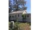 Side view of a house showing new roof and gray vinyl siding at 4905 Court St, Zephyrhills, FL 33541