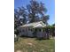 Classic home featuring mature trees, a new roof, and neutral exterior paint at 4905 Court St, Zephyrhills, FL 33541