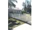 White picket fence surrounds the yard, adding charm and security to the property's exterior at 4905 Court St, Zephyrhills, FL 33541