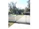 A white picket fence with a gate encloses the yard, adding to the property's charm and curb appeal at 4905 Court St, Zephyrhills, FL 33541