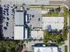 Aerial view showcasing beach volleyball courts, ample parking, and nearby commercial buildings at 10263 Gandy N Blvd # 2014, St Petersburg, FL 33702