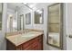 Bathroom features a shower and tub combination, a granite vanity, and a decorative framed mirror at 10263 Gandy N Blvd # 2014, St Petersburg, FL 33702