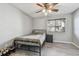 Bedroom with a ceiling fan, a window, neutral paint, and laminate flooring at 10263 Gandy N Blvd # 2014, St Petersburg, FL 33702