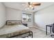 Bedroom with a bed, desk, fresh neutral paint, a window, and wood-look flooring at 10263 Gandy N Blvd # 2014, St Petersburg, FL 33702