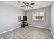 Bedroom with fresh neutral paint, a window, and wood-look flooring at 10263 Gandy N Blvd # 2014, St Petersburg, FL 33702