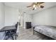 Bedroom features neutral paint, laminate flooring, and a view into the bathroom at 10263 Gandy N Blvd # 2014, St Petersburg, FL 33702
