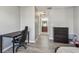 Bedroom features neutral paint, laminate flooring, and a view into the bathroom at 10263 Gandy N Blvd # 2014, St Petersburg, FL 33702