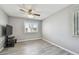 Bedroom with neutral paint, laminate flooring, a ceiling fan, and a window at 10263 Gandy N Blvd # 2014, St Petersburg, FL 33702