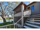 Condo building exterior with stairs leading up to the units and a glimpse of the lake at 10263 Gandy N Blvd # 2014, St Petersburg, FL 33702